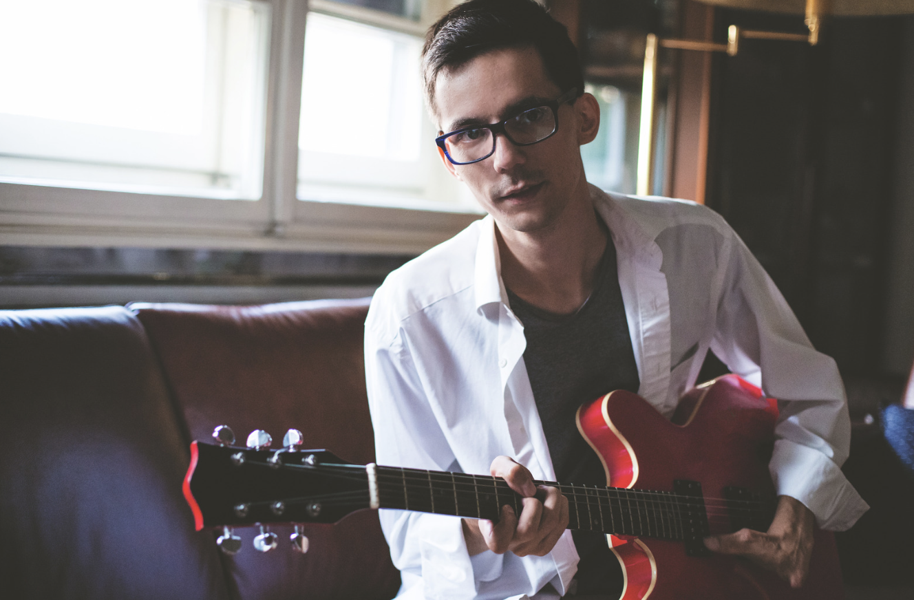 Kyle, guitarist with adaptive hand challenge